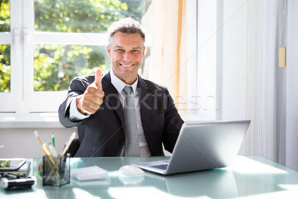 Stock photo: Happy Businessman Gesturing Thumbs Up