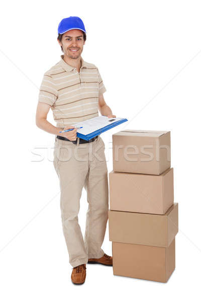 Delivery man asking to sign delivery confirmation Stock photo © AndreyPopov