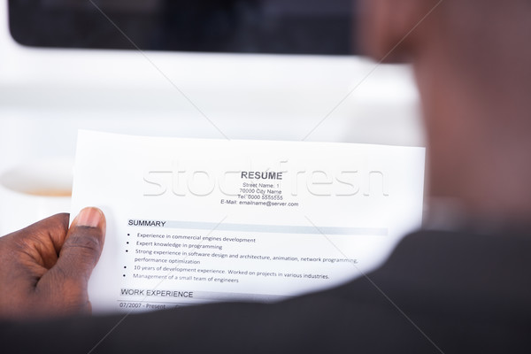 Személy olvas önéletrajz közelkép üzletember néz Stock fotó © AndreyPopov