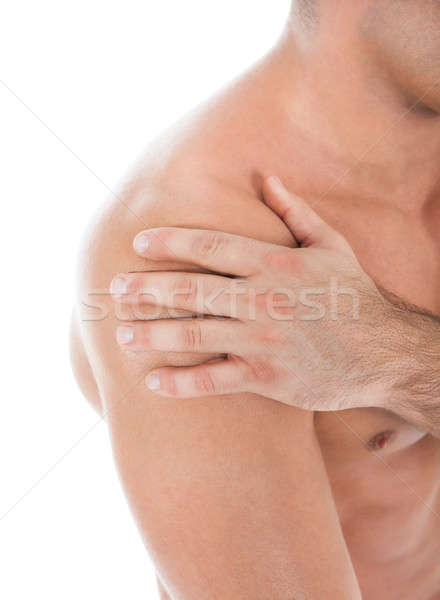 Junger Mann Leiden Schulterschmerzen muskuläre medizinischen Stock foto © AndreyPopov