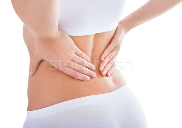 Donna sofferenza mal di schiena dolore indietro Foto d'archivio © AndreyPopov