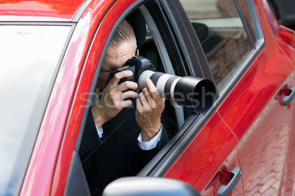 Man Photographing With Slr Camera From Car Stock photo © AndreyPopov
