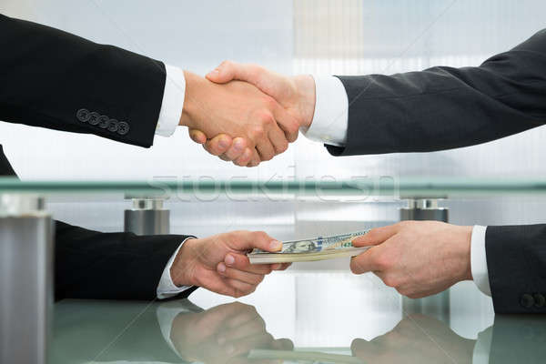 Businessman Accepting An Offer Of Money Stock photo © AndreyPopov