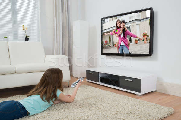 Girl Watching Movie On Television Stock photo © AndreyPopov