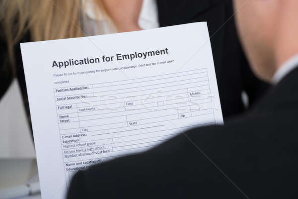 Candidate Holding Application Form In Front Of Interviewer Stock photo © AndreyPopov
