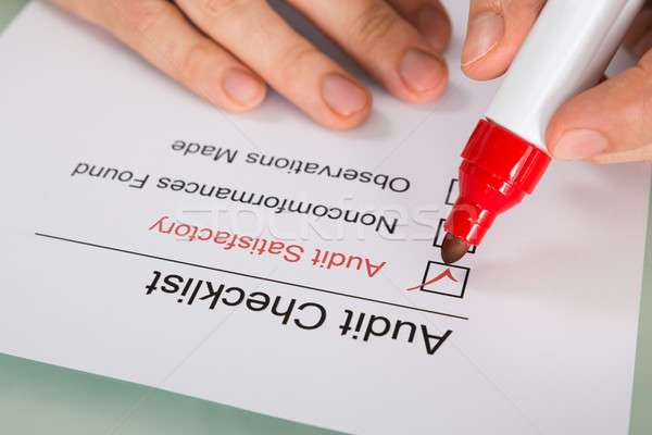 Person Filling Audit Checklist Form Stock photo © AndreyPopov