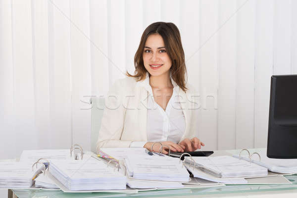 Businesswoman Calculating Tax Stock photo © AndreyPopov