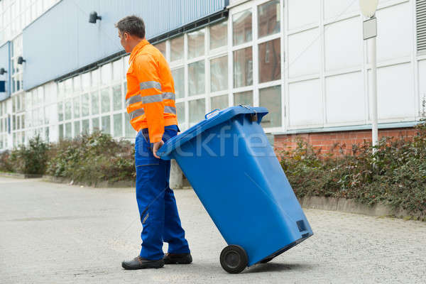 Male Worker Walking With Dustbin On Street Stock photo © AndreyPopov