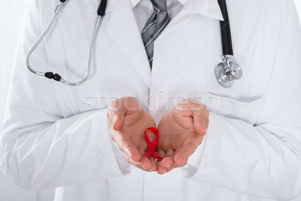 Férfi orvos tart AIDS szalag közelkép sztetoszkóp Stock fotó © AndreyPopov