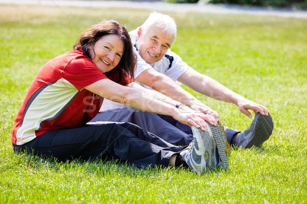 Couple Doing Stretching Exercise Stock photo © AndreyPopov