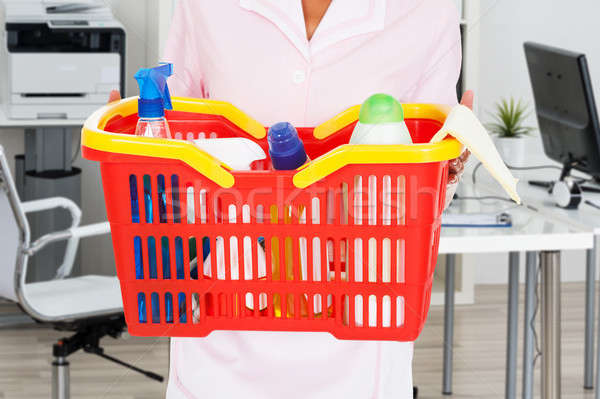 Stock photo: Female Janitor Holding Cleaning Equipment