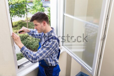 Worker Applying Silicone Sealant With Silicone Gun Stock photo © AndreyPopov