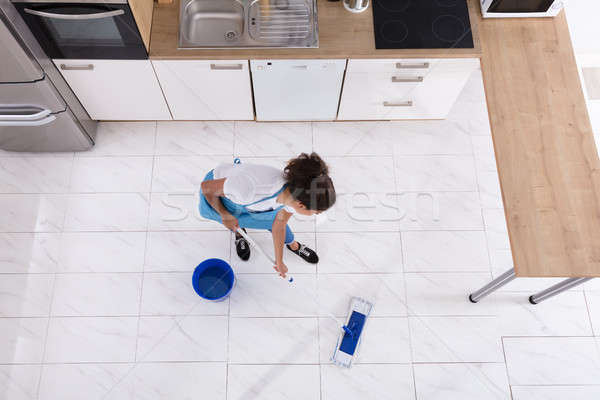 Woman Cleaning Floor With Mop Stock photo © AndreyPopov