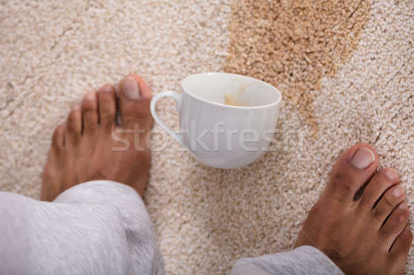 Person's Feet Standing Near Spilled Coffee Stock photo © AndreyPopov