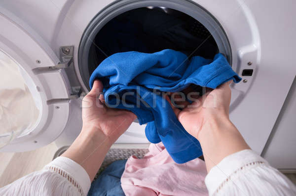 Mano blu panno lavatrice primo piano sporca Foto d'archivio © AndreyPopov