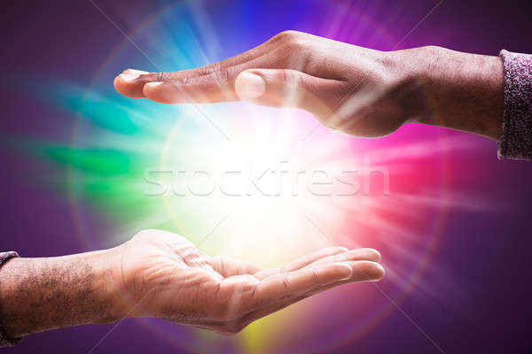 Glowing Lights Flowing From An Open Hand Stock photo © AndreyPopov
