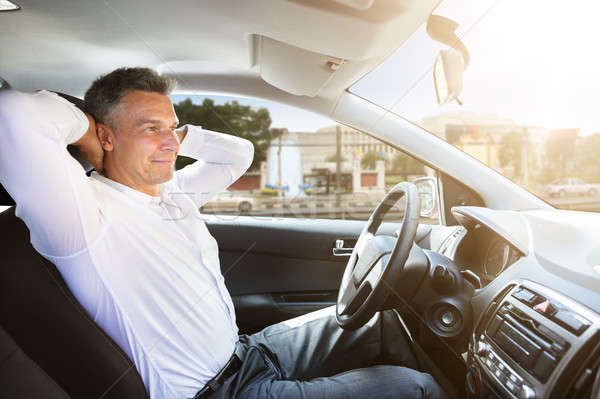 Relaxed Man Sitting In Self Driving Car Stock photo © AndreyPopov