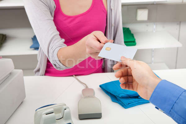 Client Handing Over Credit Card To A Cashier Stock photo © AndreyPopov