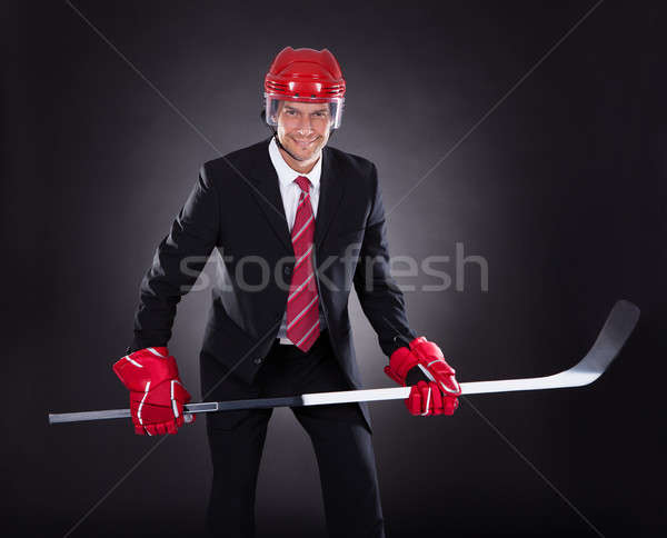 Businessman Dressed As Hockey Player Stock photo © AndreyPopov