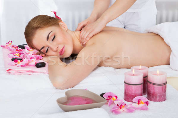 Frau Massage Behandlung lächelnd Blume Stock foto © AndreyPopov