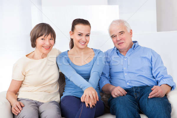 Happy Caregiver With Senior Couple Stock photo © AndreyPopov