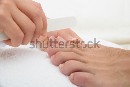Manicurist Doing Pedicure Stock photo © AndreyPopov