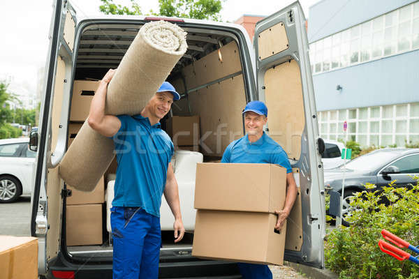Arbeitnehmer tragen Teppich Karton Boxen zwei Stock foto © AndreyPopov