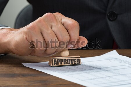 Businessman Giving Cheque To Other Person Stock photo © AndreyPopov