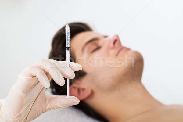 Man Getting Wrinkle Treatment From Doctor Stock photo © AndreyPopov