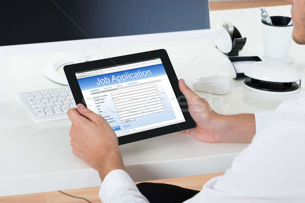 Businessman Filling Online Job Application Form Stock photo © AndreyPopov