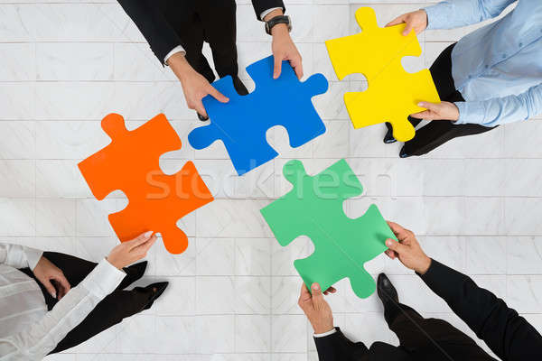 Geschäftsleute halten Puzzleteile Ansicht Team Stock foto © AndreyPopov