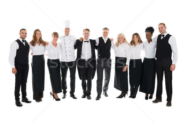 Confident Restaurant Staff Standing With Arms Around Stock photo © AndreyPopov