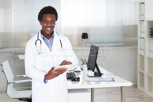 Stock photo: Confident Doctor Using Digital Tablet