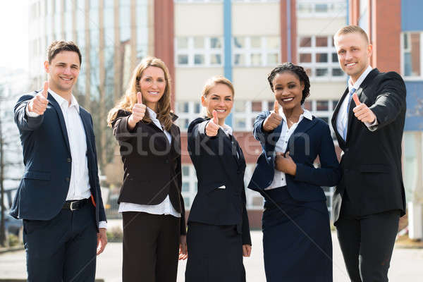 Group Of Businesspeople Showing Thumb Ups Stock photo © AndreyPopov