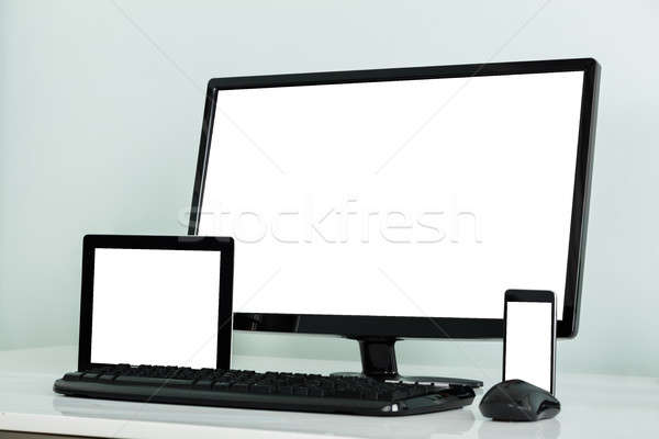 Computer Desktop With Digital Tablet And Mobilephone On Desk Stock photo © AndreyPopov