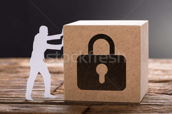 Papel hombre empujando candado signo Foto stock © AndreyPopov