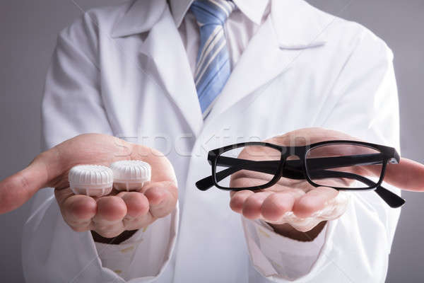 Doctor's Hand With Eyeglasses And Lens Case Stock photo © AndreyPopov