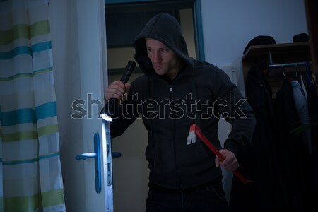 Thief Entering Into House Stock photo © AndreyPopov