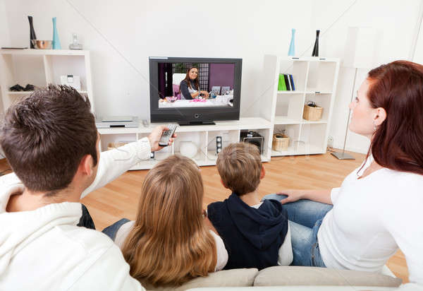 Jovem família assistindo tv casa juntos Foto stock © AndreyPopov