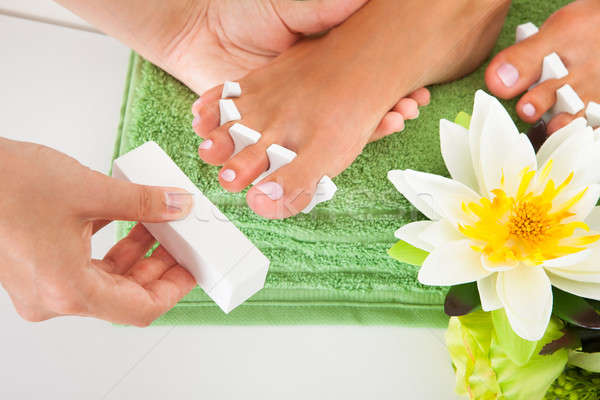 Manicurist Filing A Female Nails Stock photo © AndreyPopov