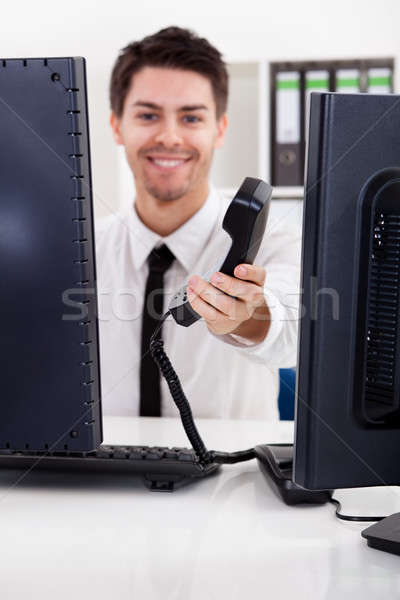 Smiling stock broker with telephone Stock photo © AndreyPopov