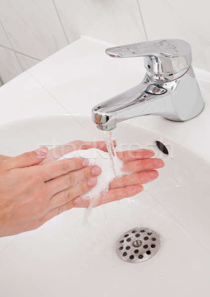 Human hands being washed under faucet Stock photo © AndreyPopov