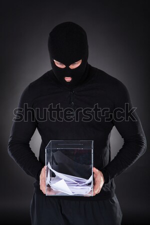 Thief stealing a laptop computer Stock photo © AndreyPopov