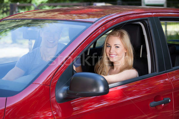 Feliz mujer hombre sesión coche nuevo retrato Foto stock © AndreyPopov