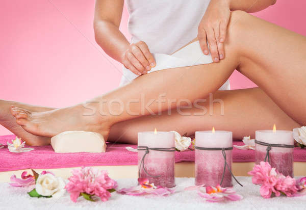 Therapist Waxing Customer's Leg At Spa Stock photo © AndreyPopov