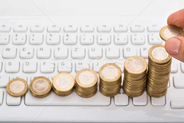 Stock photo: Close-up Of Person Stacking Coins
