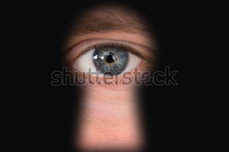 Person Looking Through Keyhole Stock photo © AndreyPopov