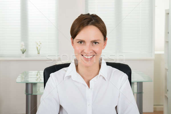 Heureux femme d'affaires bureau portrait jeunes séance [[stock_photo]] © AndreyPopov