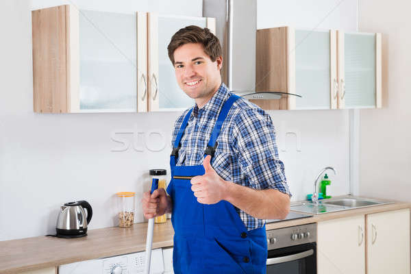 Stock photo: Worker Mopping Floor