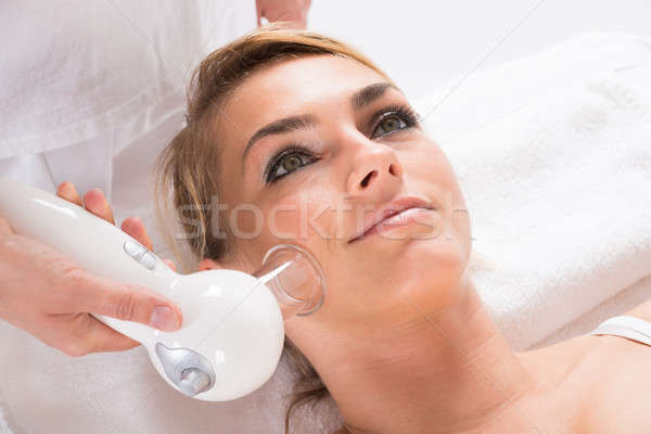 Woman Receiving Cellulite Vacuum Therapy On Face Stock photo © AndreyPopov